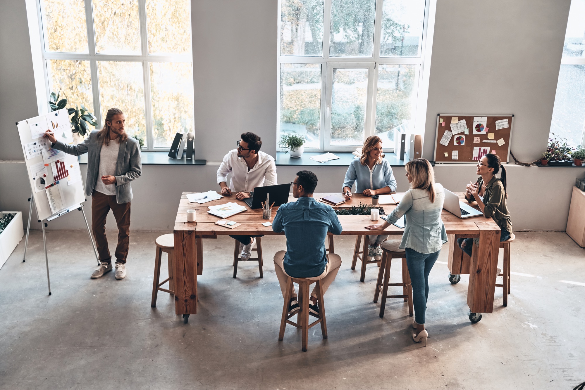Professionals sharing ideas around a meeting table